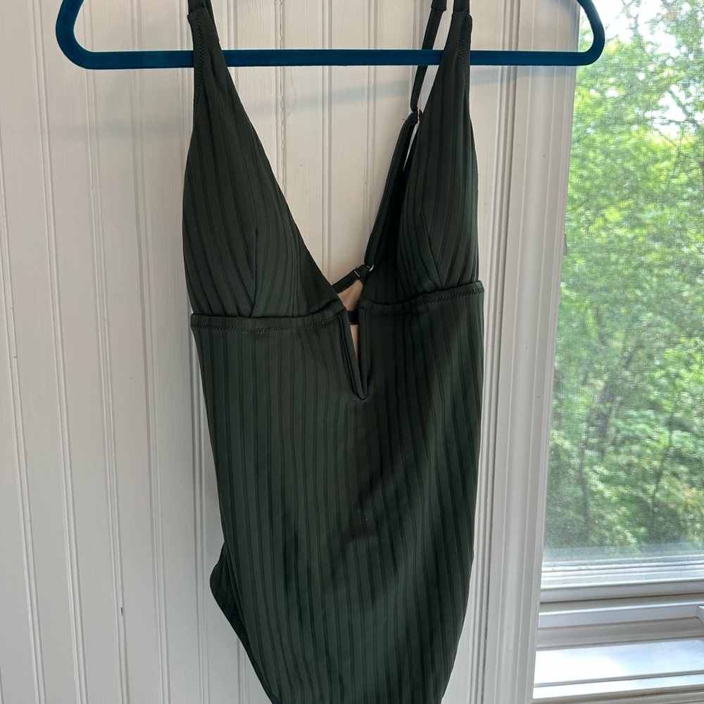 NWT green one hi-cut piece plunge swimming suit or body suit, adjustable straps